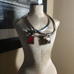 Silver necklaces set with square pendants